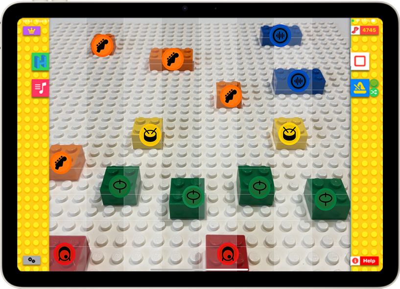 BeatBlocks on an iPad: coloured bricks laid across a baseplate, each tagged with an instrument icon, playing as an 8-beat loop.